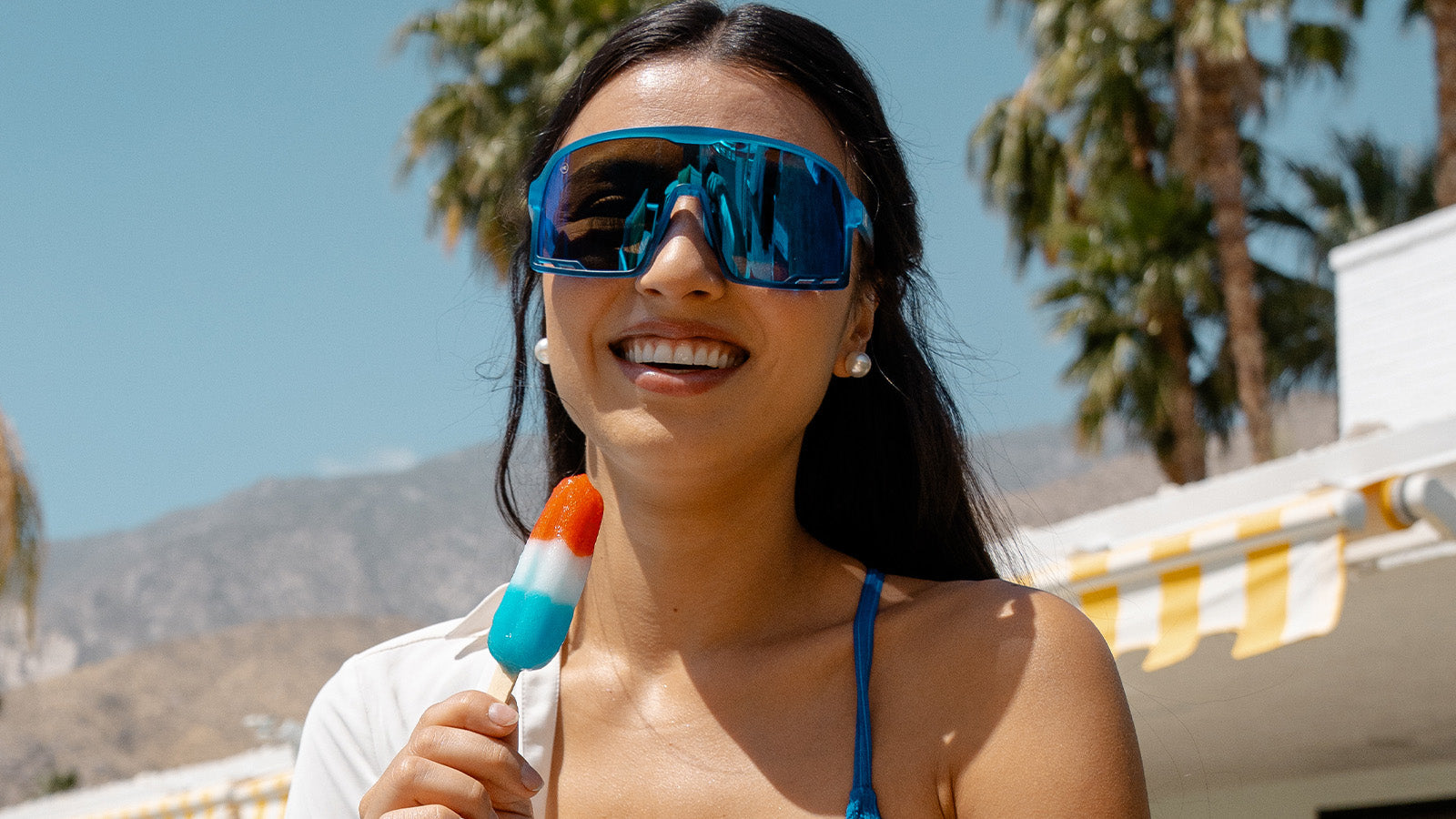 Woman wearing Knockaround Rocket Pop Campeones