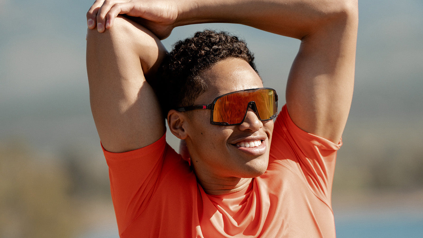 Sport Sunglasses with Clear Grey Frames and Red Sunset Lenses, Model