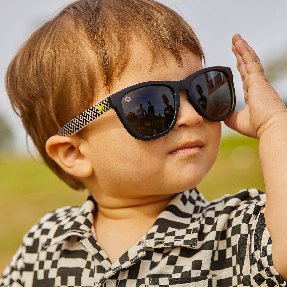 Kids Sunglasses with glossy Fronts and Checkerboard Arms with Polarized Black Smoke Lenses, Model