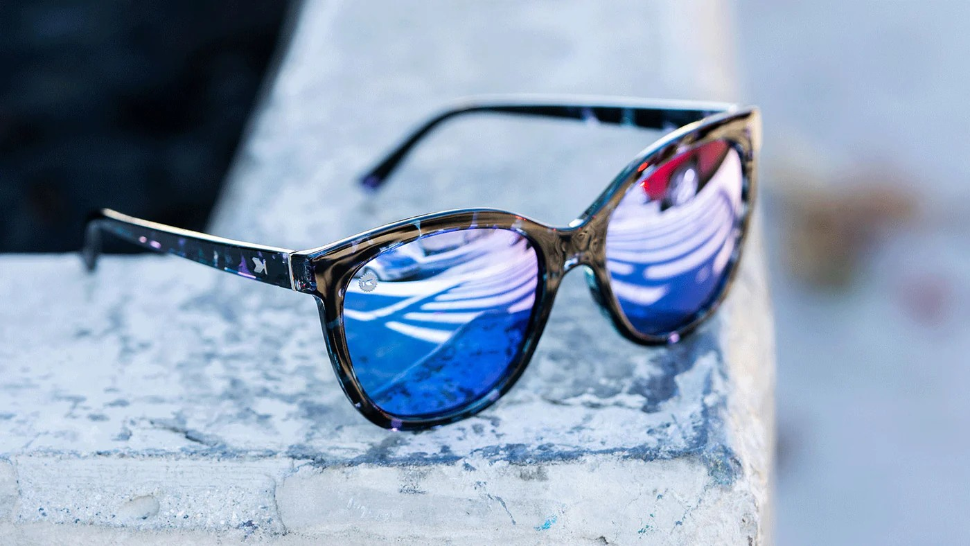 Sunglasses with Indigo Ink Frames and Polarized Snow Opal Lenses, Flyover