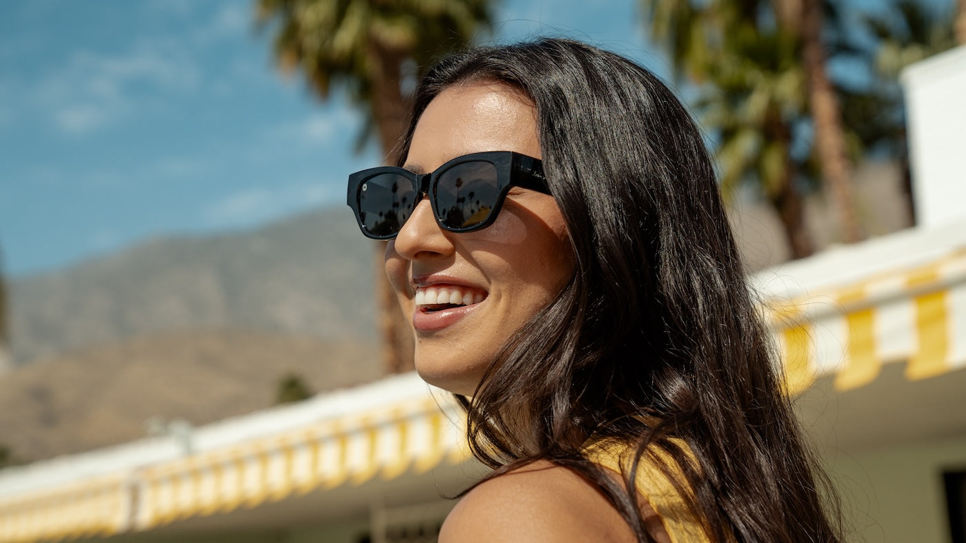 Female wearing Piano Black Junipers Sunglasses