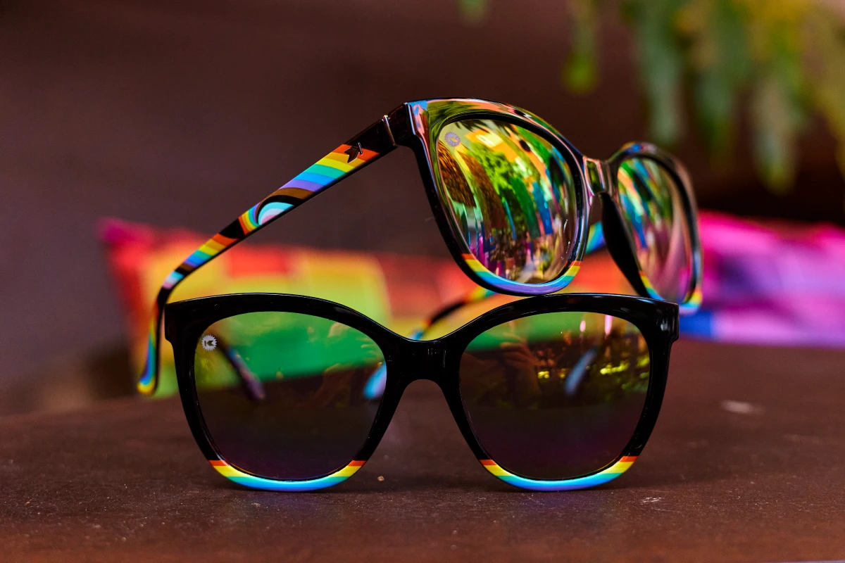 Black sunglasses with a rainbow gradient and rainbow lenses 