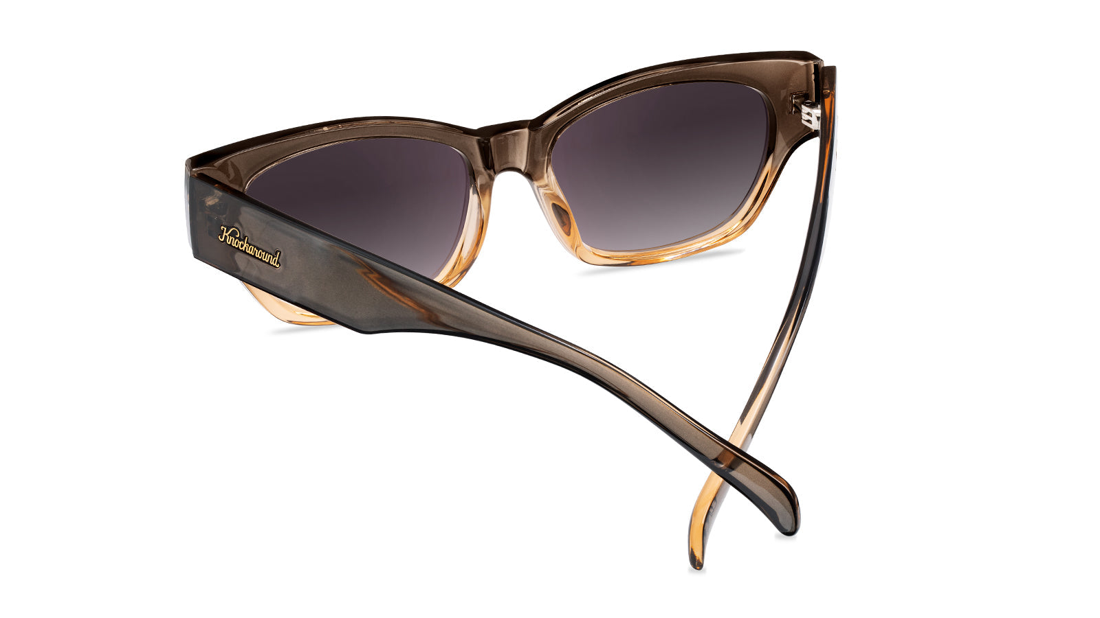 Sunglasses with a glossy muted-gray-to-peach frame and polarized smoke gradient lenses, Back