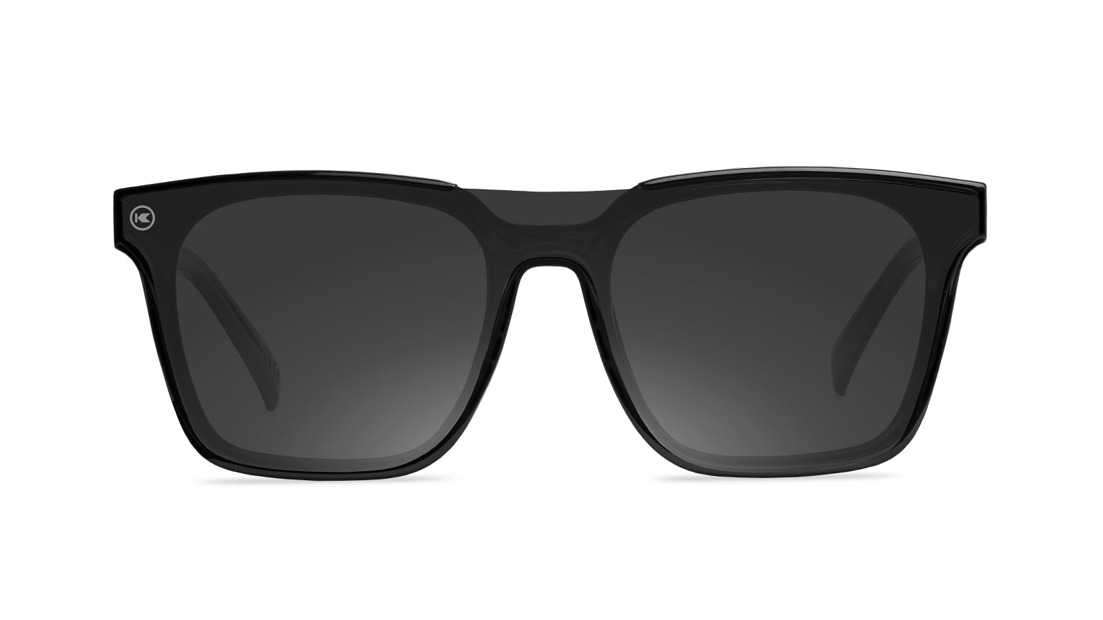 Sunglasses with a black frame with polarized black lenses, flyover