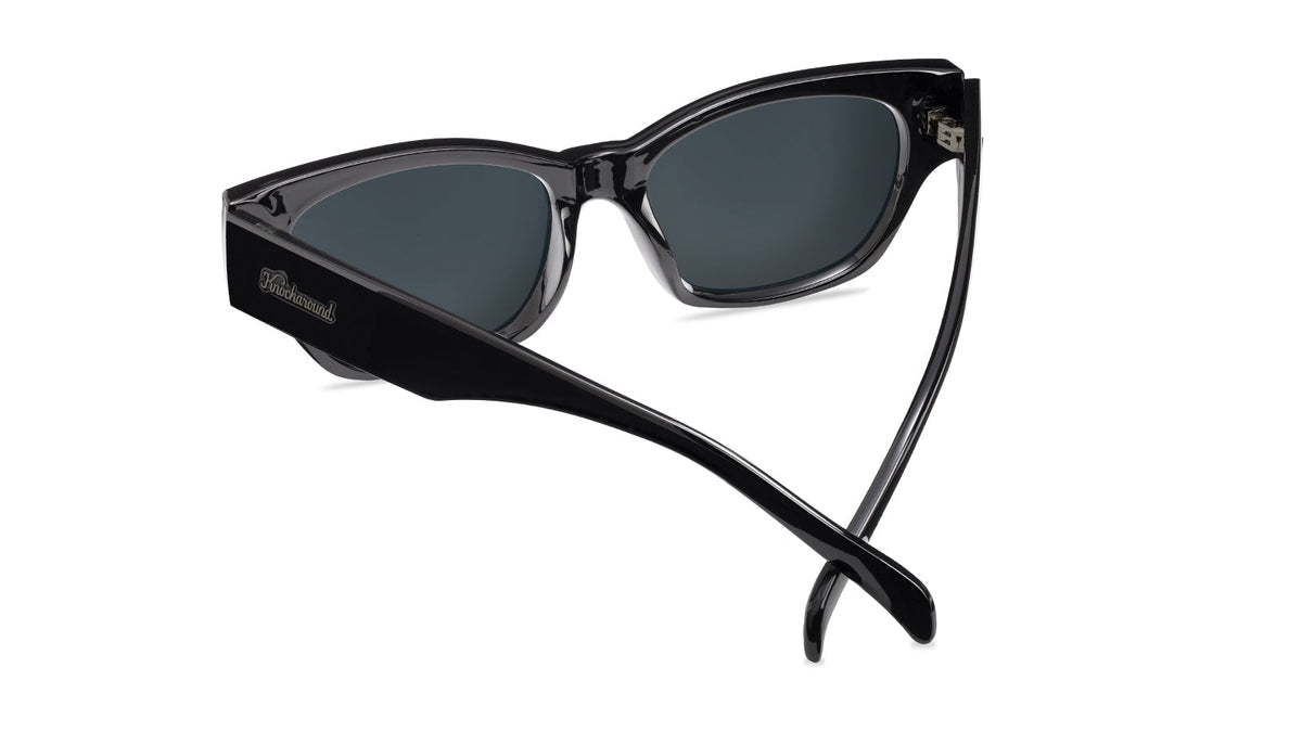 Sunglasses with a glossy black frame and polarized smoke lenses, Back
