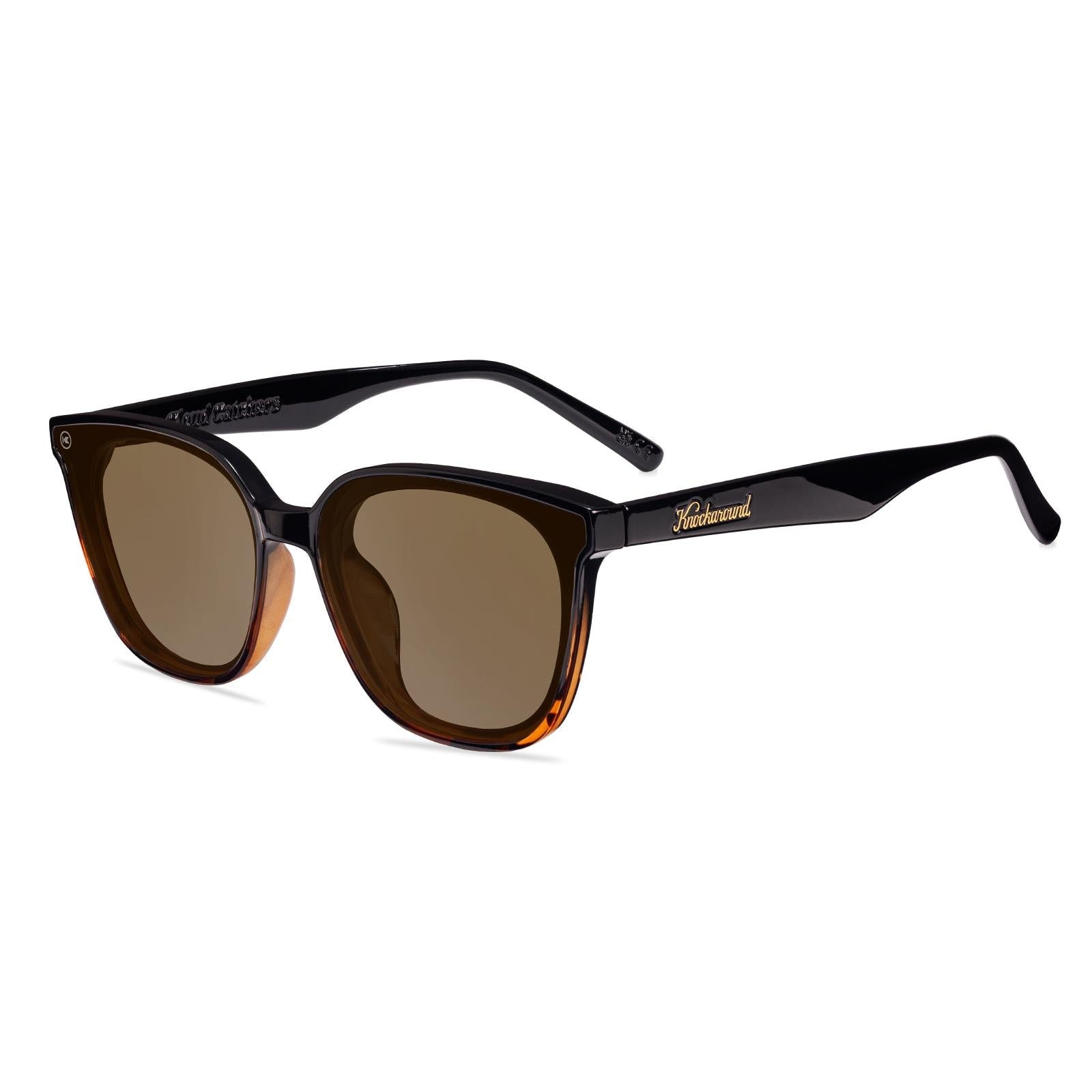 Sunglasses with a amber frame with polarized amber lenses, flyover
