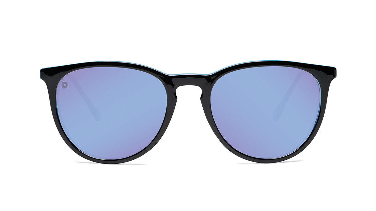 Sunglasses with Glossy Black Exterior and Ice Blue to Lavender Interior and Polarized Snow Opal Lenses. Flyover